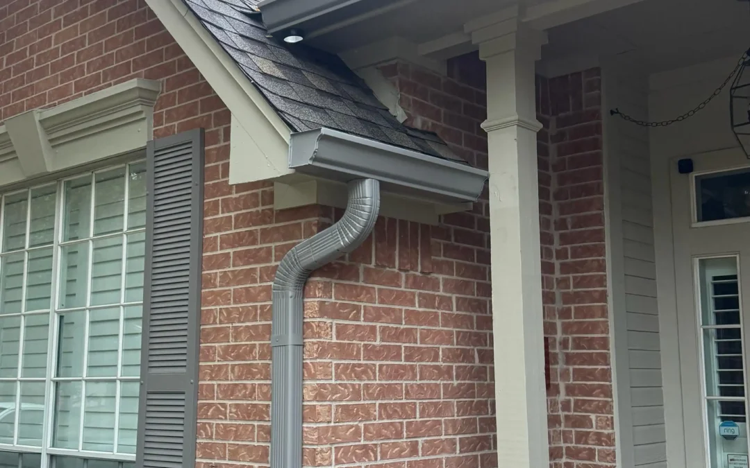 Gray Seamless Gutter and Downspout Installation