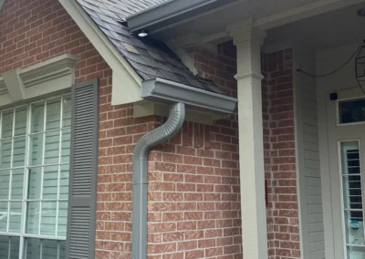 Gray Seamless Gutter and Downspout Installation